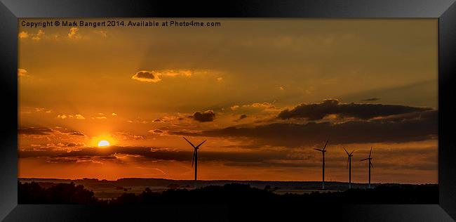 Wind turbines against the sunset Framed Print by Mark Bangert