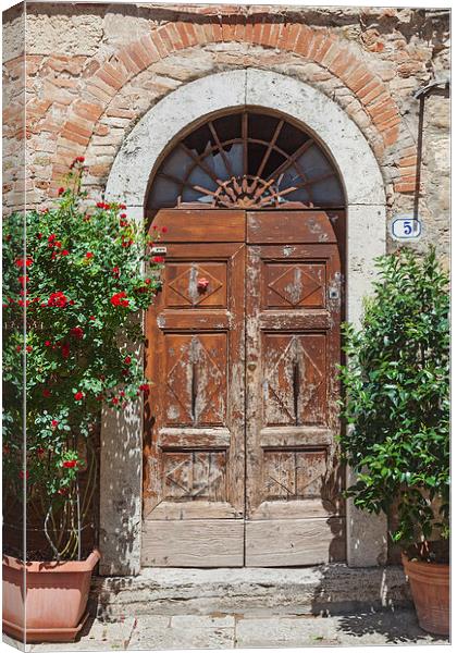 Antiquated Tuscan doorway Canvas Print by Ian Duffield