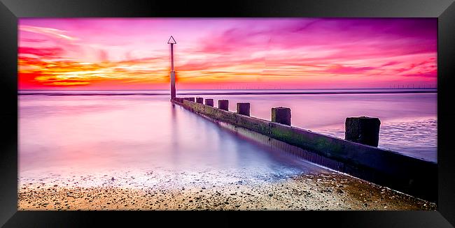 A Glowing Sunset at Rhyl Beach Framed Print by Darren Wilkes
