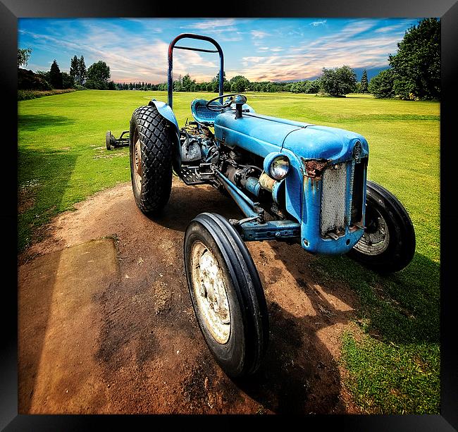Nostalgic Charm of a Blue Tractor Framed Print by P D