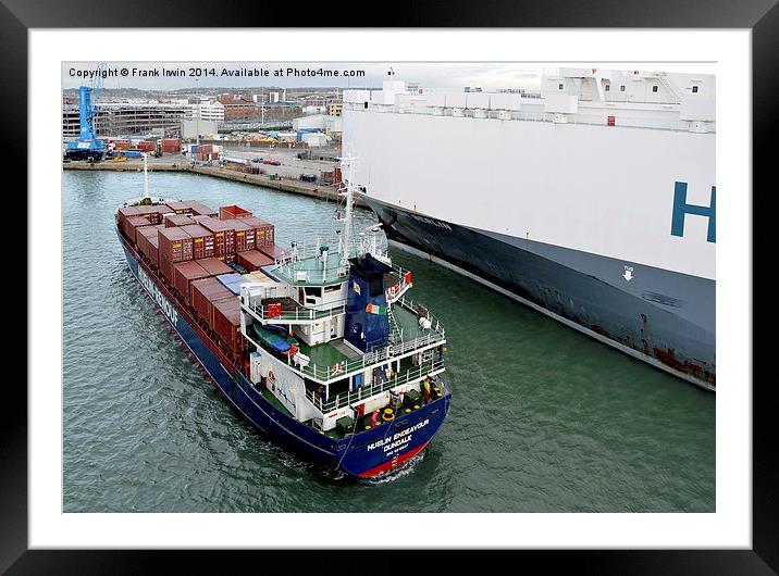 A small container ship plies its trade in Southamp Framed Mounted Print by Frank Irwin