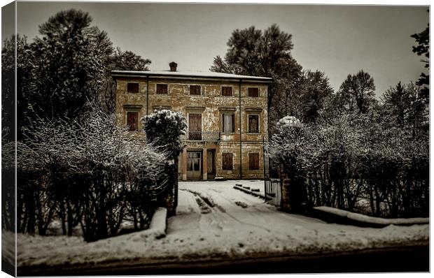 Old country house with snow Canvas Print by Guido Parmiggiani