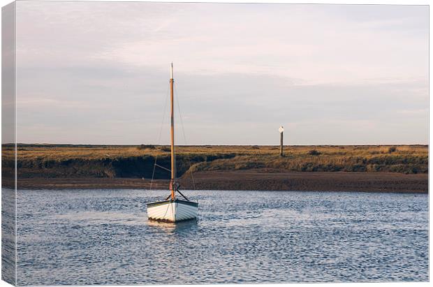 Boat and marshes. Burnham Overy Staithe. Canvas Print by Liam Grant