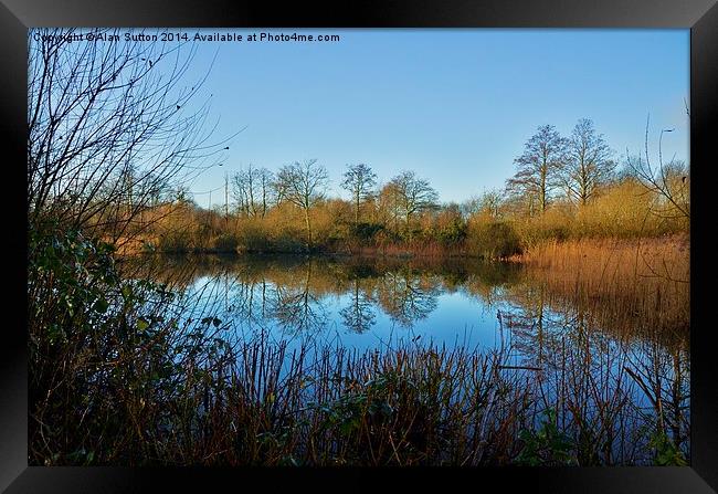 Reflections on a winters morning. Framed Print by Alan Sutton