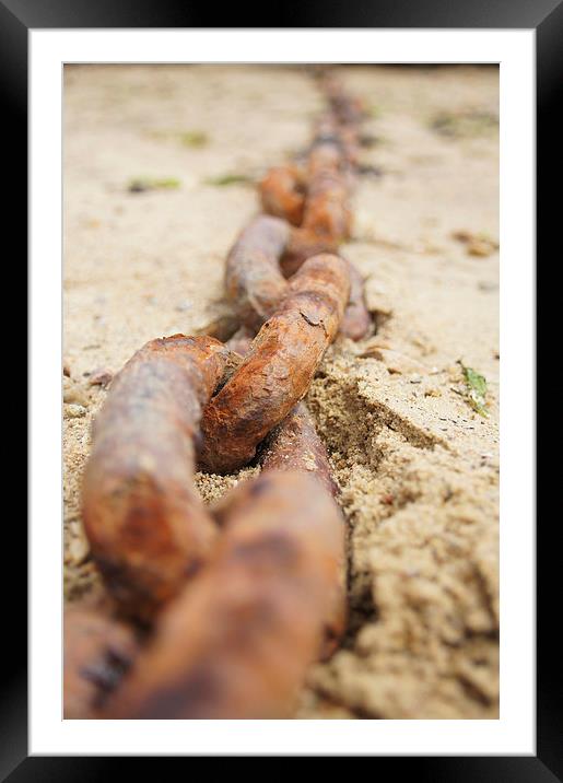 Rusty ship chain in sand Framed Mounted Print by Eric Fouwels