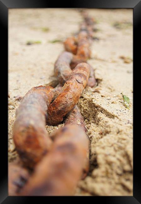 Rusty ship chain in sand Framed Print by Eric Fouwels