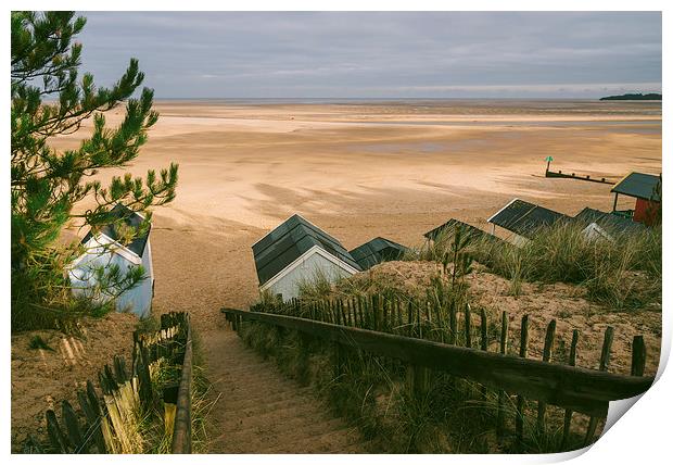 Beach huts, steps and sunlit view out to sea. Print by Liam Grant