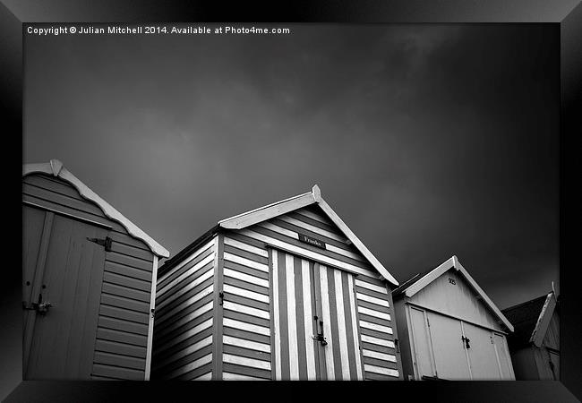 Stormy Beach Huts Framed Print by Julian Mitchell