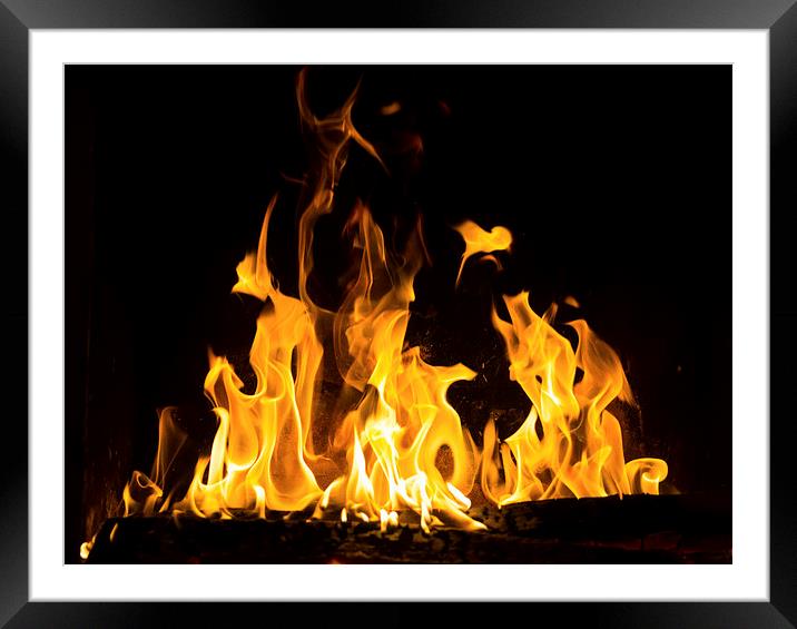 fireplace  ablaze Framed Mounted Print by Eric Fouwels