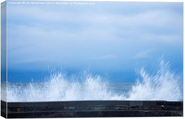 Waves crashing over seawall in Scarborough Canvas Print by Ian Middleton
