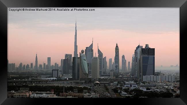 Dubai at Dusk Framed Print by Andrew Warhurst