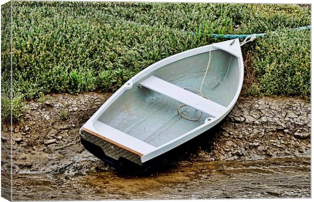 A rowing boat or tender craft beached in Heswall. Canvas Print by Frank Irwin