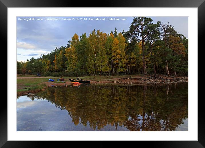 Canoes on the shore at Loch An Eilein Framed Mounted Print by Louise Heusinkveld