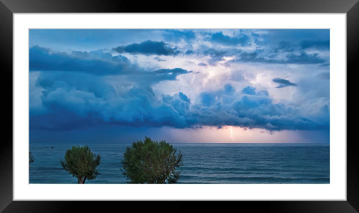 Thunderstorm and lightning over the ocean Framed Mounted Print by Nikos Vlasiadis