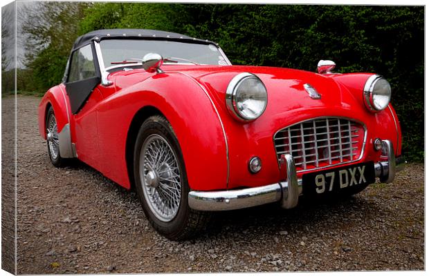 Roaring red TR3 A timeless british classic Canvas Print by Alan Tunnicliffe