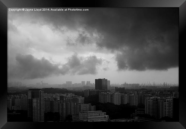 View of Singapore with clouds Framed Print by J Lloyd