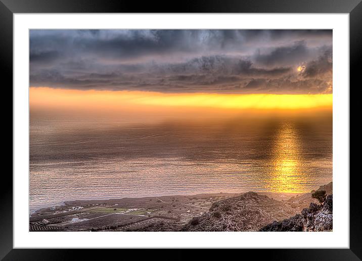 Reflection on the ocean from an orange sunset Framed Mounted Print by Nikos Vlasiadis