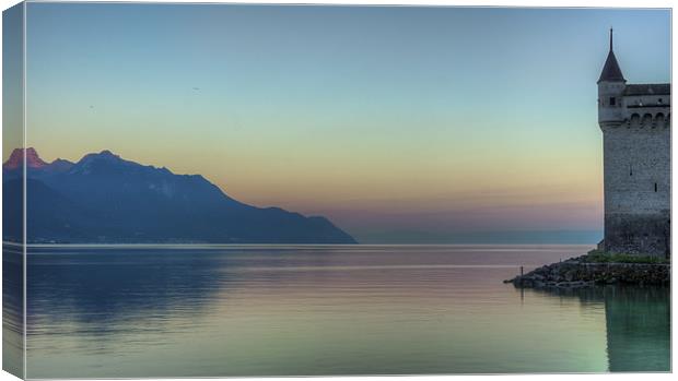 Chillon Castle by the lake at sunrise Canvas Print by Olavs Silis