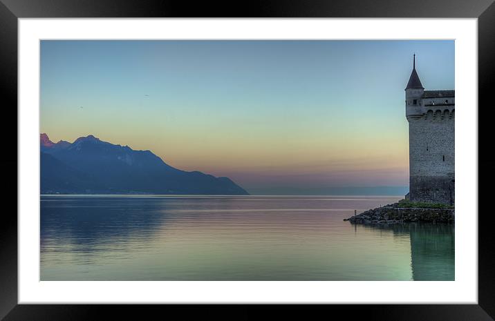 Chillon Castle by the lake at sunrise Framed Mounted Print by Olavs Silis