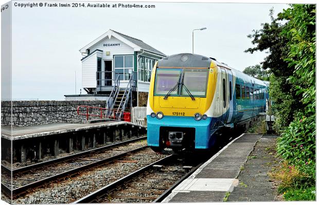 An Arriva train arriving at Deganwy Station Canvas Print by Frank Irwin