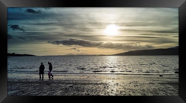 Evening stroll on the beach Framed Print by Geo Harris