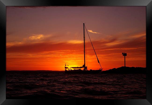 Sunset Sailboat Framed Print by Ian Pettman