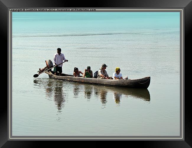 Tourists in a Log Boat Framed Print by Susmita Mishra