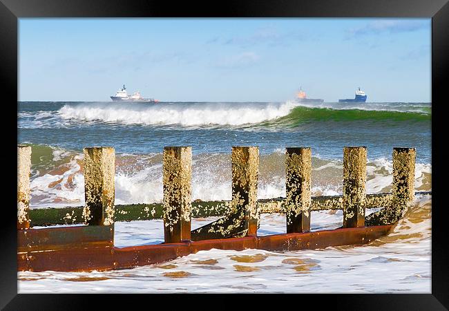 Against The Waves Framed Print by Bill Buchan
