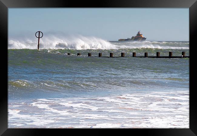 Chased By Waves Framed Print by Bill Buchan