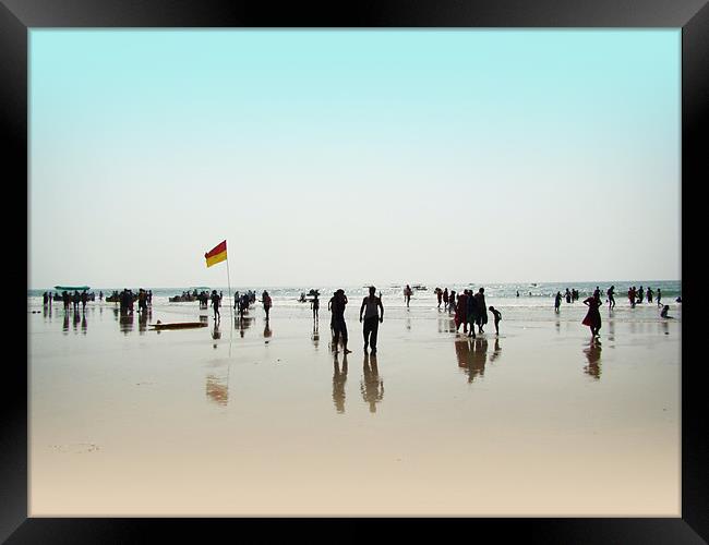 Tourists on a Sea Beach Framed Print by Susmita Mishra
