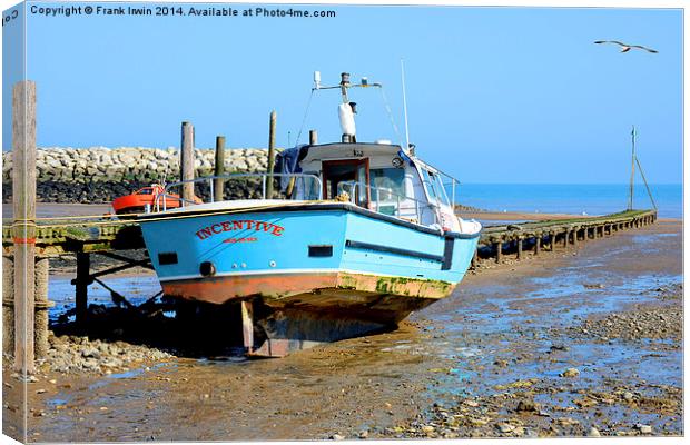 A fishing boat sits high and dry in Rhos-on-Sea Canvas Print by Frank Irwin