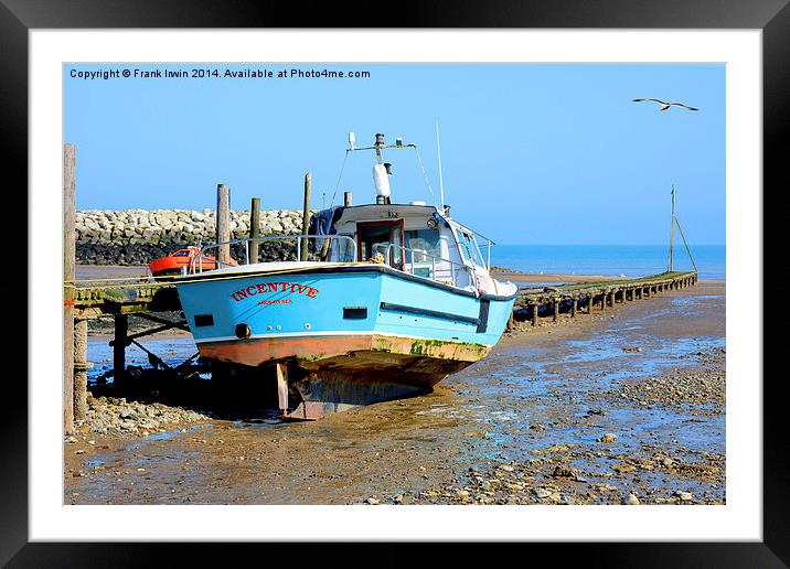 A fishing boat sits high and dry in Rhos-on-Sea Framed Mounted Print by Frank Irwin