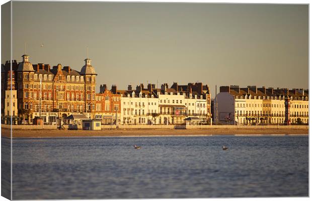 Sunrise over Weymouth Bay in March Canvas Print by Paul Brewer