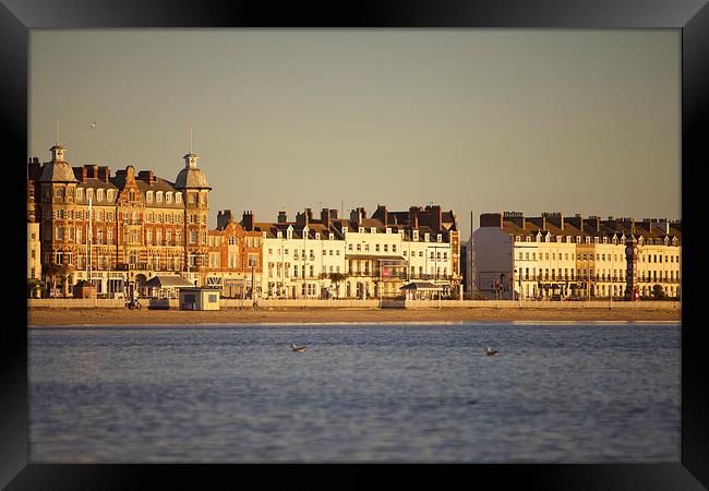 Sunrise over Weymouth Bay in March Framed Print by Paul Brewer