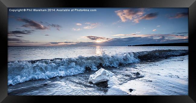 A wave and a rock Framed Print by Phil Wareham