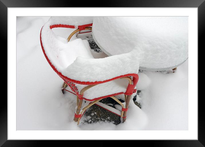 Snow-covered red chair Framed Mounted Print by Matthias Hauser