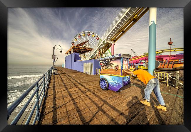 Pushing on the pier Framed Print by Rob Hawkins