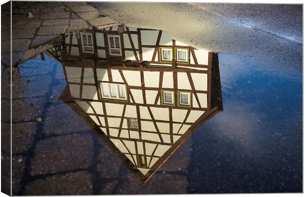 Half-timbered house water reflection Canvas Print by Matthias Hauser