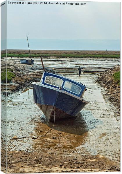 A small motorboat beached in Heswall. Canvas Print by Frank Irwin
