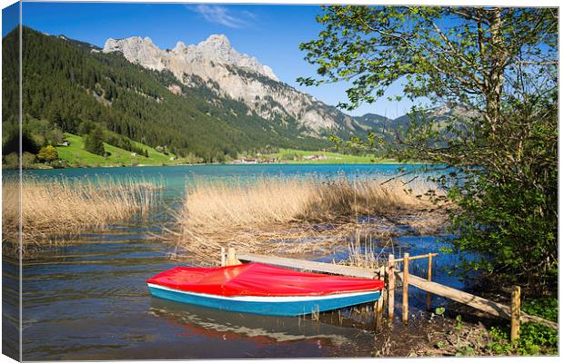 Red boat lake and mountains Canvas Print by Matthias Hauser