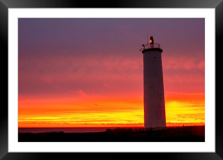 Lighthouse at sunset Framed Mounted Print by Ian Jones