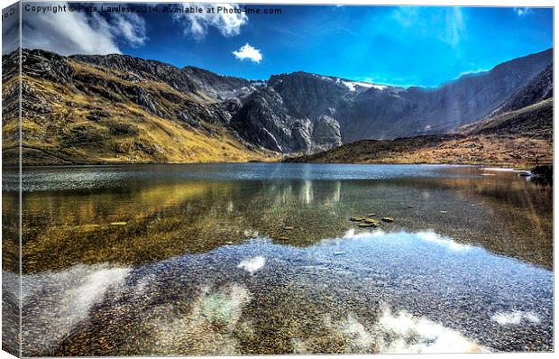 The Gylders relecting in llyn Idwal Canvas Print by Pete Lawless