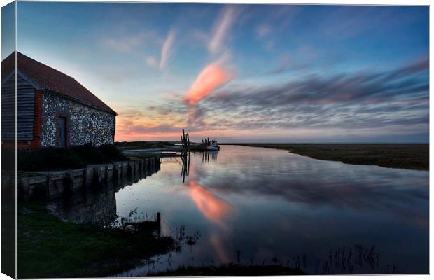 Reflections of sunset Thornham harbour Canvas Print by Gary Pearson