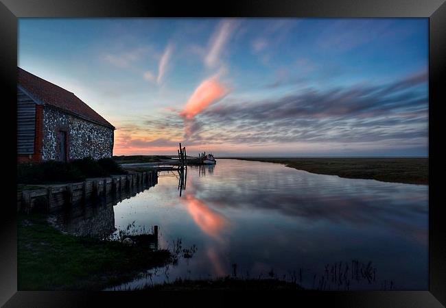 Reflections of sunset Thornham harbour Framed Print by Gary Pearson
