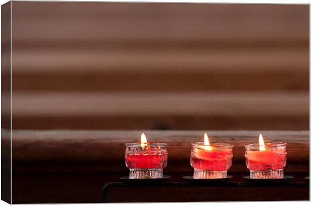 Three prayer candles in church Canvas Print by Matthias Hauser