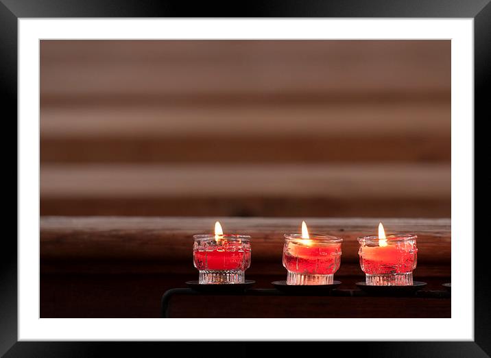 Three prayer candles in church Framed Mounted Print by Matthias Hauser