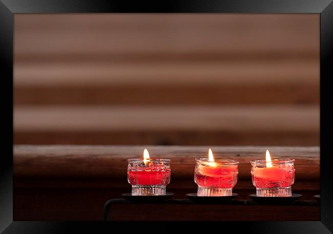 Three prayer candles in church Framed Print by Matthias Hauser