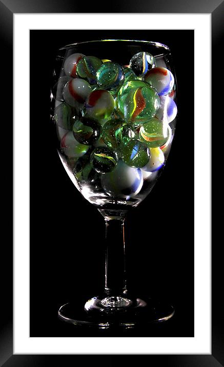 a glass of Marbles Framed Mounted Print by Doug McRae
