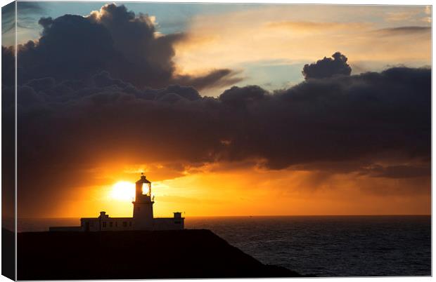 Sunset at Strumble Head Lighthouse Canvas Print by Ian Middleton