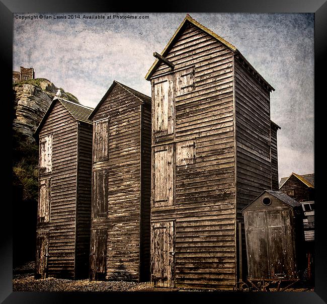 Fishermens Huts at Hastings Framed Print by Ian Lewis